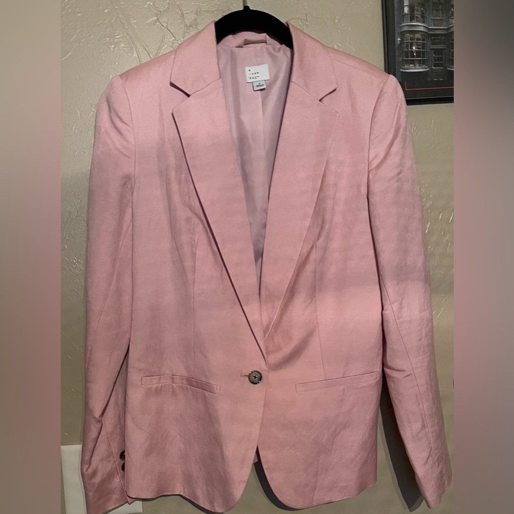 Women’s linen suit jacket. Will keep you warm but not hot!